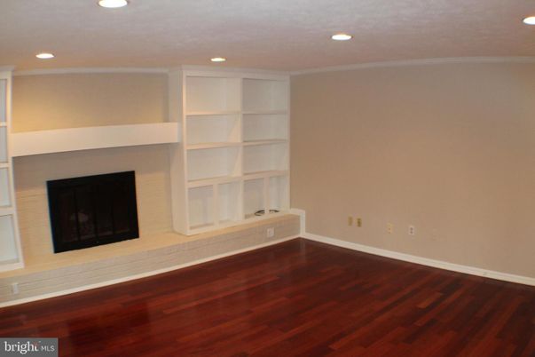 Empty room, Fireplace, Interior, Recessed Lighting, Wood Texture Flooring