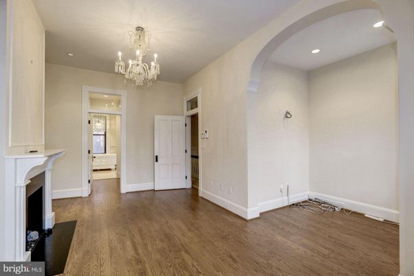 Chandelier, Empty room, Fireplace, Interior, Recessed Lighting, Wood Texture Flooring