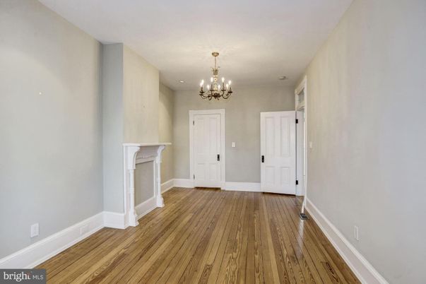 Chandelier, Empty room, Fireplace, Interior, Recessed Lighting, Wood Texture Flooring
