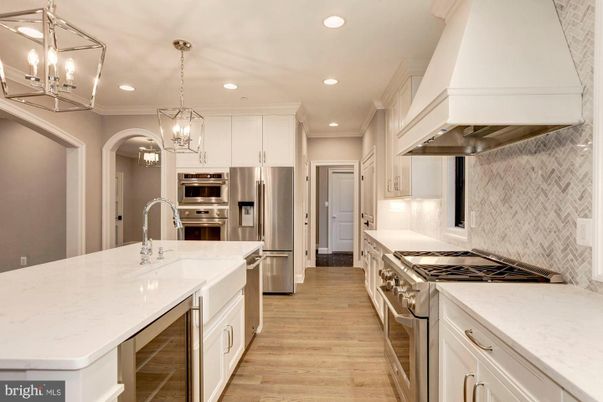 Chandelier, Interior, Kitchen, Pendant Lights, Recessed Lighting, Stainless Steel Appliances, Wood Texture Flooring