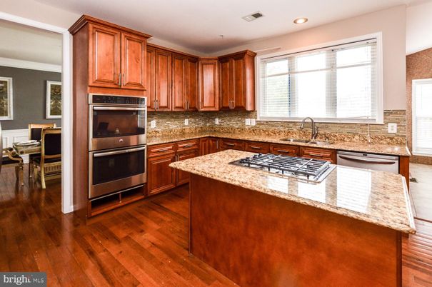 Dining room, Interior, Kitchen, Recessed Lighting, Stainless Steel Appliances, Wood Texture Flooring