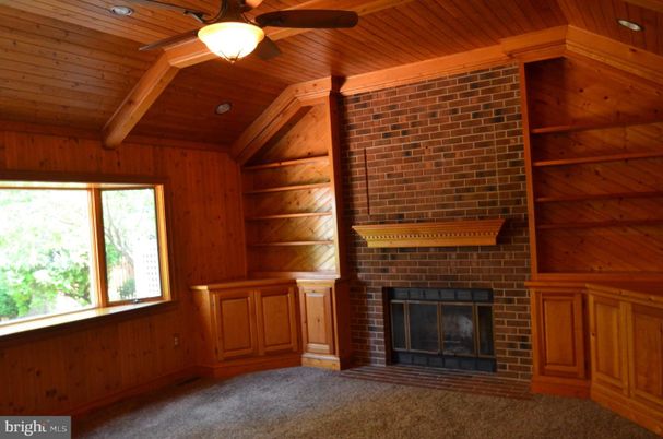 Empty room, Fireplace, Interior, Recessed Lighting, Stone Walls, Wooden Beams, Wooden Ceilings, Wooden Walls