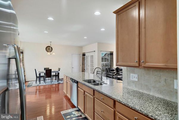 Dining room, Interior, Kitchen, Recessed Lighting, Stainless Steel Appliances, Wood Texture Flooring