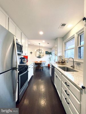 Dining room, Interior, Kitchen, Recessed Lighting, Stainless Steel Appliances, Wood Texture Flooring