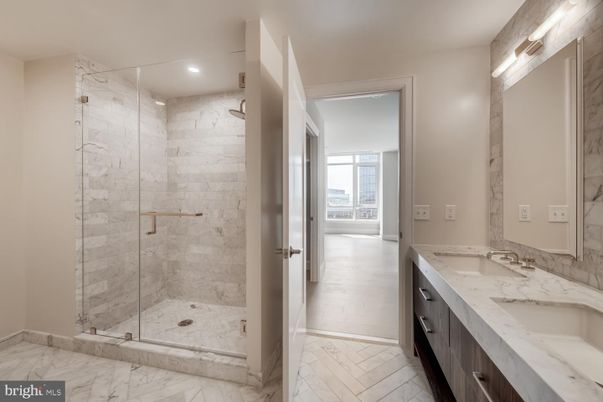 Bathroom, Dual Sink Vanities, Glass Shower, Interior, Marble, Marble Walls, Recessed Lighting