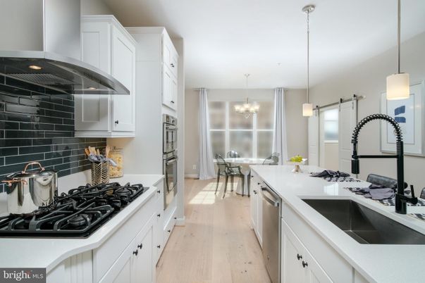 Chandelier, Dining room, Interior, Kitchen, Pendant Lights, Stainless Steel Appliances, Wood Texture Flooring
