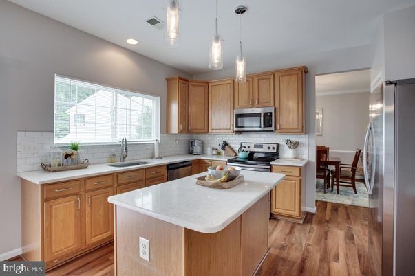 Dining room, Interior, Kitchen, Pendant Lights, Recessed Lighting, Stainless Steel Appliances, Wood Texture Flooring