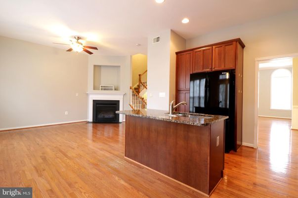 Empty room, Fireplace, Interior, Kitchen, Recessed Lighting, Wood Texture Flooring