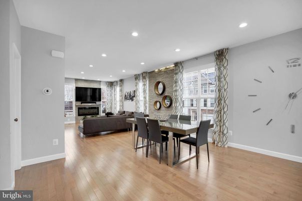 Dining room, Fireplace, Interior, Living room, Recessed Lighting, Wood Texture Flooring