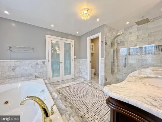 Bathroom, Dual Sink Vanities, Glass Shower, Interior, Marble Walls, Recessed Lighting