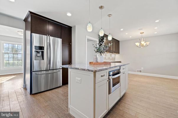 Chandelier, Interior, Kitchen, Pendant Lights, Recessed Lighting, Stainless Steel Appliances, Wood Texture Flooring
