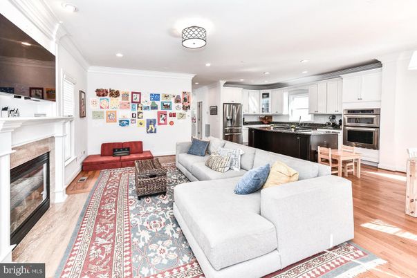 Fireplace, Interior, Kitchen, Living room, Recessed Lighting, Stainless Steel Appliances, Wood Texture Flooring