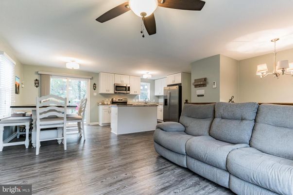 Chandelier, Dining room, Interior, Kitchen, Living room, Stainless Steel Appliances, Wood Texture Flooring