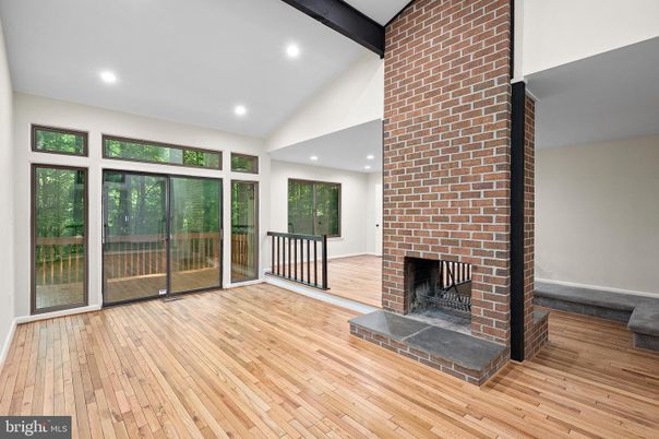 Empty room, Fireplace, Interior, Recessed Lighting, Stone Walls, Wood Texture Flooring