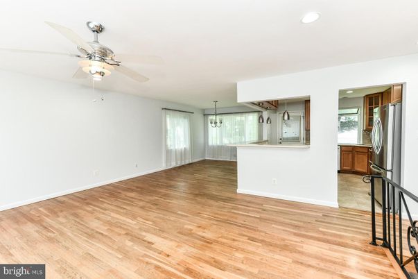 Empty room, Interior, Kitchen, Recessed Lighting, Stainless Steel Appliances, Wood Texture Flooring