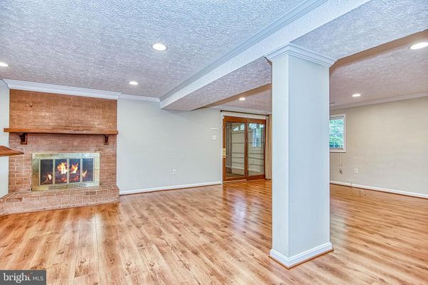Empty room, Fireplace, Interior, Recessed Lighting, Stone Walls, Wood Texture Flooring