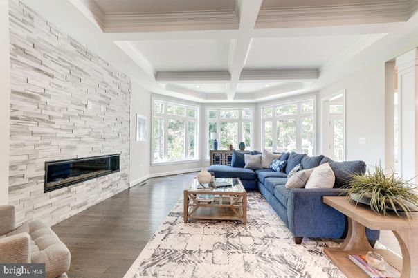 Fireplace, Interior, Living room, Recessed Lighting, Stone Walls, Wood Texture Flooring