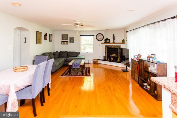 Dining room, Fireplace, Interior, Living room, Recessed Lighting, Wood Texture Flooring