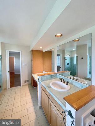 Bathroom, Dual Sink Vanities, Interior, Recessed Lighting, Tile Countertops