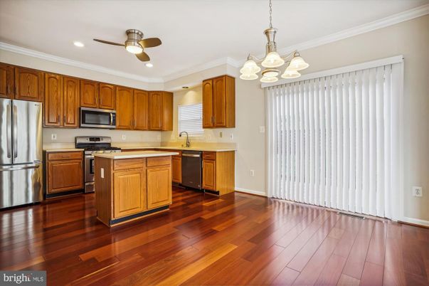 Chandelier, Interior, Kitchen, Recessed Lighting, Stainless Steel Appliances, Wood Texture Flooring