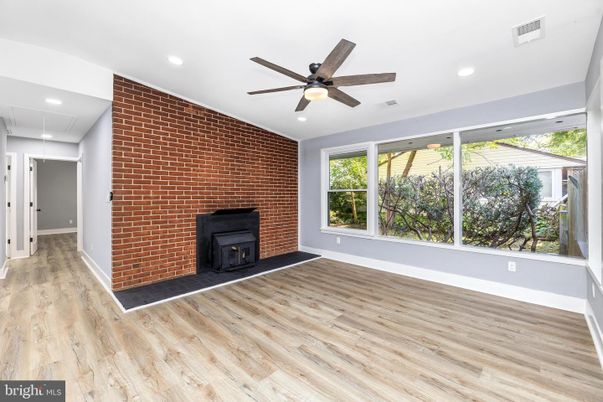 Empty room, Fireplace, Interior, Recessed Lighting, Stone Walls, Wood Texture Flooring