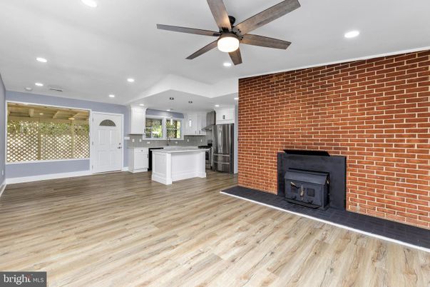 Empty room, Fireplace, Interior, Kitchen, Recessed Lighting, Stone Walls, Wood Texture Flooring