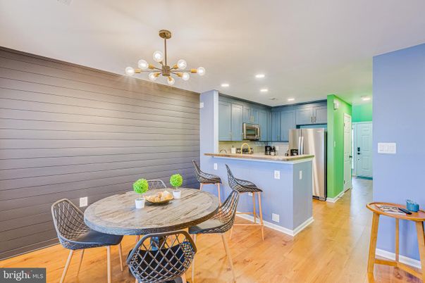 Dining room, Interior, Kitchen, Pendant Lights, Recessed Lighting, Stainless Steel Appliances, Wood Texture Flooring