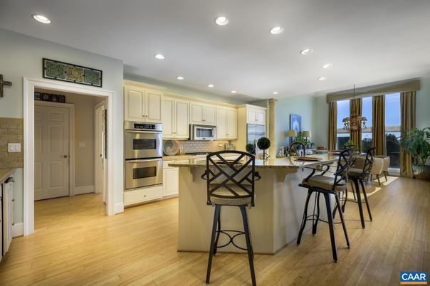 Dining room, Interior, Kitchen, Pendant Lights, Recessed Lighting, Stainless Steel Appliances, Wood Texture Flooring