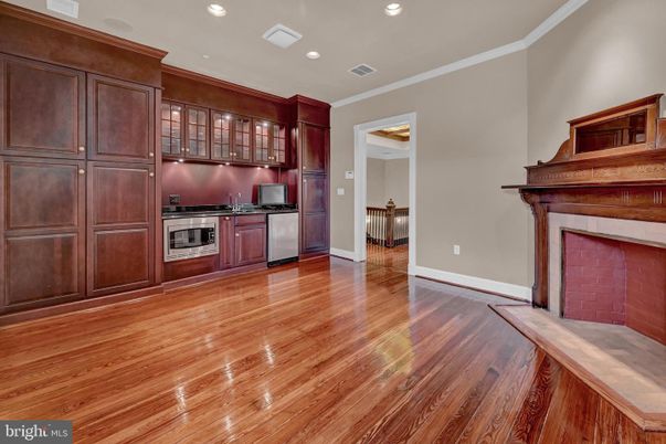Fireplace, Interior, Kitchen, Recessed Lighting, Stainless Steel Appliances, Wood Texture Flooring