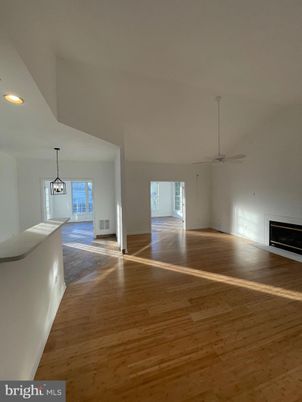 Empty room, Fireplace, Interior, Pendant Lights, Recessed Lighting, Wood Texture Flooring
