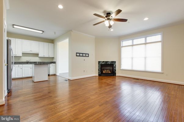 Empty room, Fireplace, Interior, Kitchen, Recessed Lighting, Wood Texture Flooring