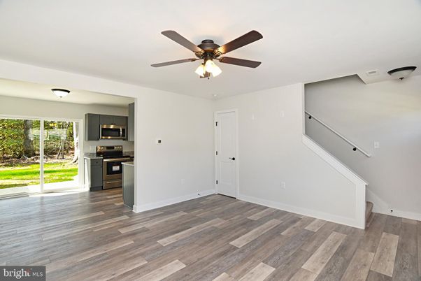 Empty room, Interior, Kitchen, Stainless Steel Appliances, Wood Texture Flooring