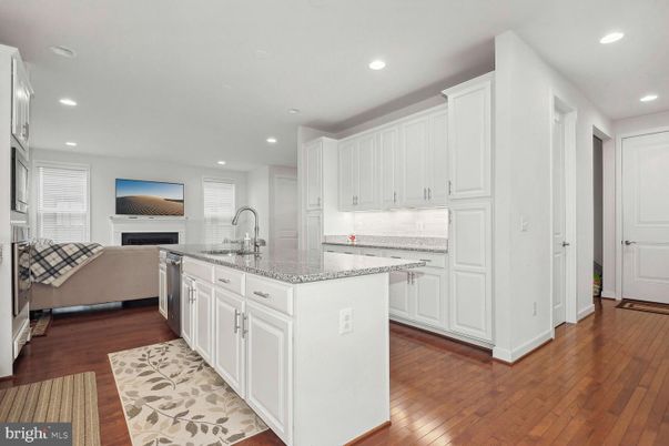 Fireplace, Interior, Kitchen, Living room, Recessed Lighting, Stainless Steel Appliances, Wood Texture Flooring