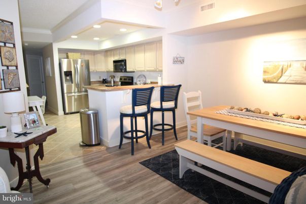 Dining room, Interior, Kitchen, Recessed Lighting, Stainless Steel Appliances, Wood Texture Flooring