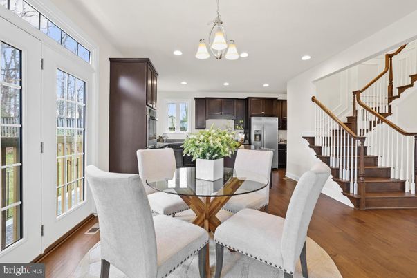 Chandelier, Dining room, Interior, Kitchen, Pendant Lights, Recessed Lighting, Stainless Steel Appliances, Wood Texture Flooring