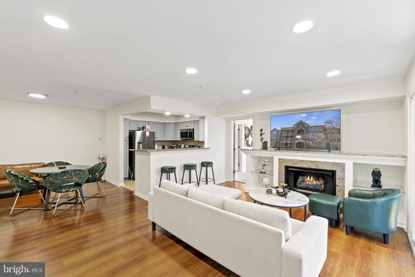 Dining room, Fireplace, Interior, Kitchen, Living room, Recessed Lighting, Stainless Steel Appliances, Wood Texture Flooring