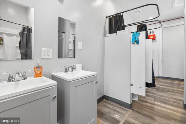 Bathroom, Dual Sink Vanities, Interior, Recessed Lighting, Wood Texture Flooring