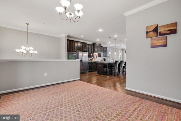 Chandelier, Dining room, Interior, Kitchen, Pendant Lights, Recessed Lighting, Stainless Steel Appliances, Wood Texture Flooring