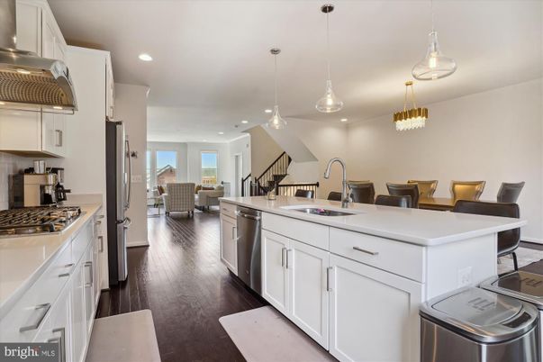 Chandelier, Dining room, Interior, Kitchen, Pendant Lights, Recessed Lighting, Stainless Steel Appliances, Wood Texture Flooring