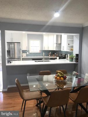 Dining room, Interior, Kitchen, Recessed Lighting, Stainless Steel Appliances, Wood Texture Flooring