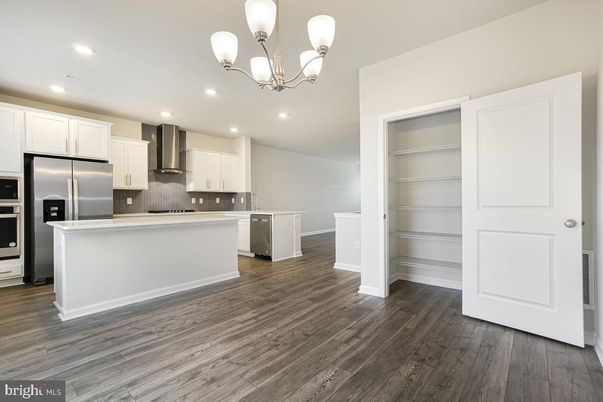 Chandelier, Interior, Kitchen, Recessed Lighting, Stainless Steel Appliances, Wood Texture Flooring