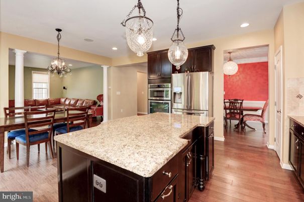 Chandelier, Dining room, Interior, Kitchen, Pendant Lights, Recessed Lighting, Stainless Steel Appliances, Wood Texture Flooring