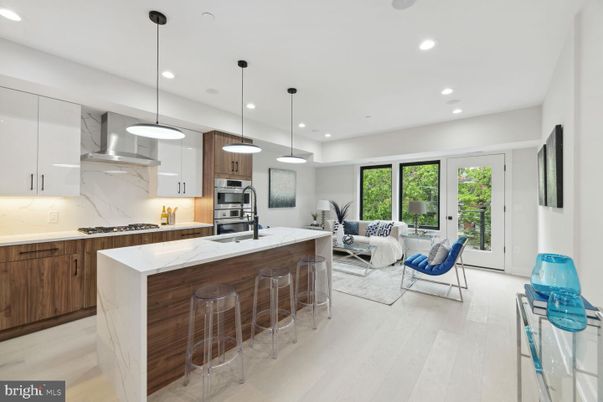 Interior, Kitchen, Living room, Marble Walls, Pendant Lights, Recessed Lighting, Stainless Steel Appliances, Wood Texture Flooring