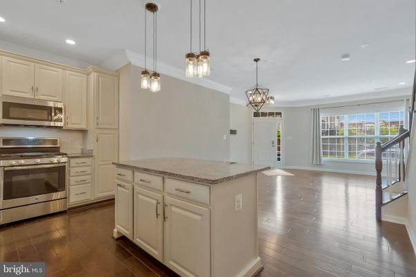 Chandelier, Interior, Kitchen, Pendant Lights, Recessed Lighting, Stainless Steel Appliances, Wood Texture Flooring