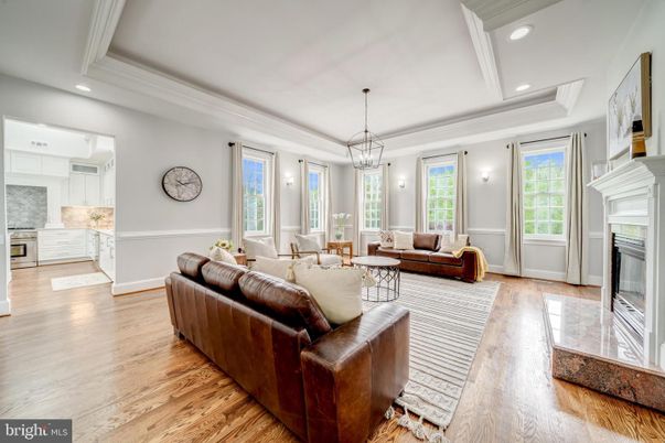 Chandelier, Fireplace, Interior, Kitchen, Living room, Pendant Lights, Recessed Lighting, Wood Texture Flooring