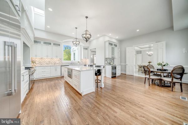 Chandelier, Dining room, Interior, Kitchen, Pendant Lights, Recessed Lighting, Stainless Steel Appliances, Wood Texture Flooring