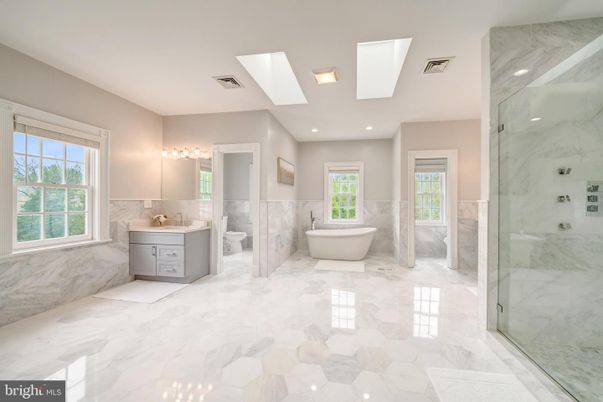 Bathroom, Dual Sink Vanities, Free Standing Baths, Glass Shower, Interior, Marble, Marble Walls, Recessed Lighting