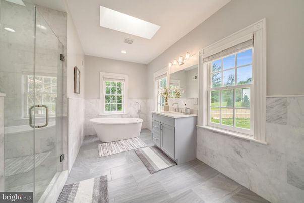 Bathroom, Dual Sink Vanities, Free Standing Baths, Glass Shower, Interior, Marble Walls, Recessed Lighting