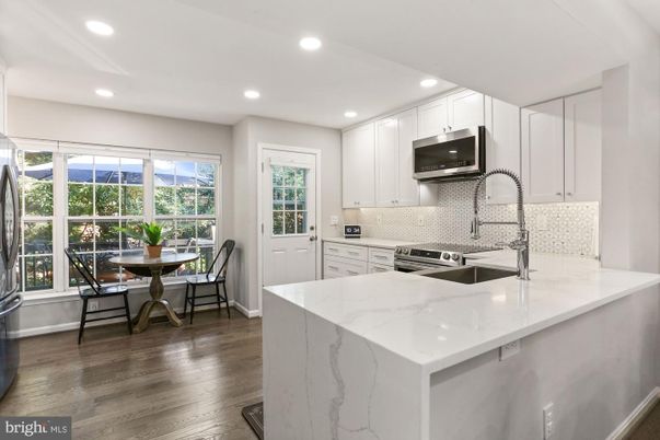 Dining room, Interior, Kitchen, Recessed Lighting, Stainless Steel Appliances, Wood Texture Flooring