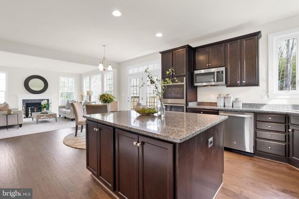 Dining room, Fireplace, Interior, Kitchen, Living room, Pendant Lights, Recessed Lighting, Stainless Steel Appliances, Wood Texture Flooring